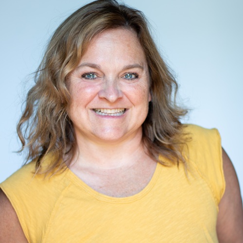 Kim Peek smiling, reflecting the themes of reinvention, adventure, and midlife renewal discussed on The Boomer Woman’s Podcast.